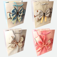 Пакет подар. бумажн. 31*40*12 см 210 гр/м2 Банты